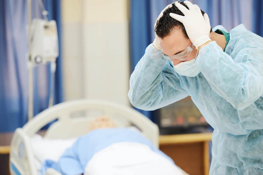 Upset Doctor Doctor Holding His Head In Shock