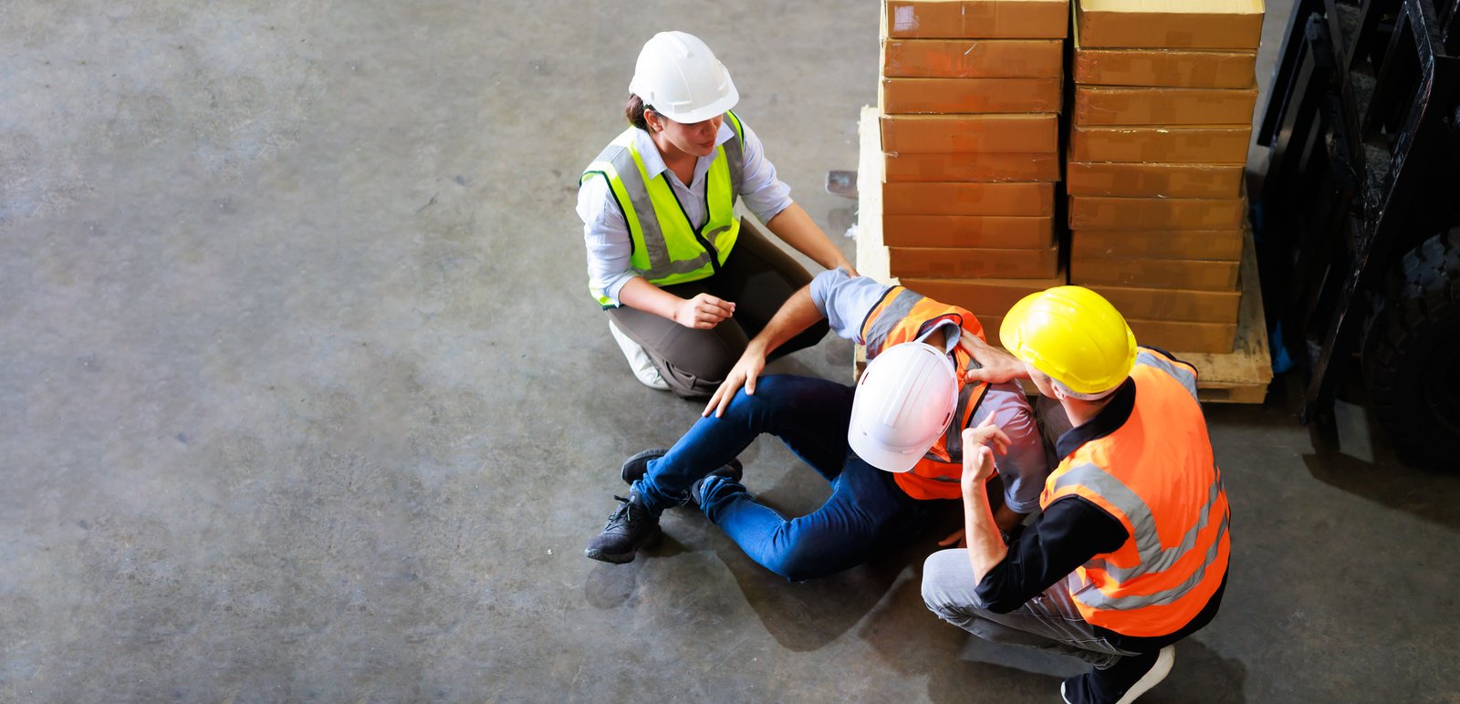 Injured worker discussing a workplace accident report with a supervisor